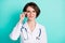 Photo portrait of smiling female doctor wearing white coat isolated on bright teal color background