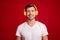 Photo portrait of smiling millennial wearing yellow headphones listening music isolated vivid red color background