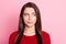 Photo portrait of suspicious unsure girl with straight brunette hair looking at side isolated on pink color background