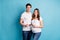 Photo portrait two people couple waiting kid birth holding tummy ultrasound screening photo happy isolated vivid blue