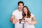 Photo portrait of two people happy couple keeping ultrasound screening photo of child amazed isolated bright blue color