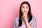 Photo portrait of unsure girl thoughtful got doubt isolated on pastel pink color background