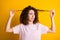 Photo portrait of upset nervous girl touching looking at curls dry hair isolated on bright yellow color background