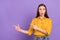 Photo portrait of woman amazed shocked showing copyspace fingers isolated on pastel violet color background