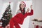 Photo portrait woman in headwear red clothes dancing cheerful dreamy in decorated apartments christmas