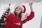 Photo portrait woman in headwear red clothes dancing in decorated apartments christmas