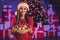 Photo portrait of woman holding wooden bowl with baubles with two hands indoors