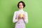 Photo portrait woman smiling drinking coffee on break isolated pastel green color background