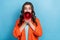 Photo portrait of young attractive woman hold loudspeaker announce shouting wear trendy orange garment  on blue