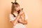 Photo portrait of young girl kissing dog small best friend isolated on pastel beige color background