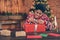 Photo portrait young man excited curious opening xmas present sitting at table wearing sweater