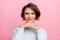 Photo of positive adorable lady hands chin look camera wear blue pullover isolated pink color background