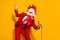 Photo of positive charismatic guy hold mic sing song wear rooster mask red suit isolated yellow color background