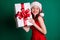 Photo positive charming girl in santa claus headwear receive get x-mas newyear christmas night wish gift box she wait