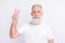 Photo of positive charming happy old man show v-sign hello cool good mood isolated on grey color background