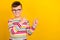 Photo of positive cheerful smart boy wear striped trendy clothes two arm direct empty space cool offers isolated on