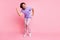Photo of positive clubber have fun dancing great vacation purple shirt isolated on pink color background