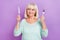 Photo of positive curious hungry lady hold knife fork look empty space wear teal shirt isolated violet color background