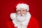 Photo of positive funky man pensioner dressed santa claus costume glasses smiling isolated red color background