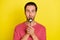 Photo of positive funny guy lick spoon enjoy delicious meal wear pink t-shirt  yellow color background