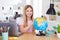 Photo of positive girl child sit table desk study remote use globe want explore earth continent in house indoors