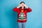 Photo of positive girl in christmas tree decor sweater close cover hands face x-mas wish gift surprise isolated over