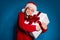 Photo of positive girl in santa claus headwear hug big gift box enjoy family dream tradition x-mas christmas celebrate