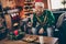 Photo of positive guy sit armchair hold remote control watch tv wear santa hat sweater decorated home indoors