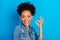 Photo of positive happy excited afro american woman show okay sign nice isolated on blue color background