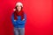 Photo of positive jolly girl in santa claus cap cross hands look copyspace magic fairy miracle newyear event wear