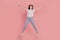 Photo of positive jumper carefree funny lady jump have fun isolated on pink color background