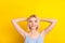 Photo of positive nice blond short hair lady rest wear blue top isolated on vivid yellow color background