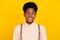 Photo of positive nice glad african guy look camera toothy smile wear suspenders shirt isolated yellow color background