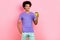 Photo of positive satisfied man wear stylish clothes hold plastic cup enjoy delicious caffeine beverage isolated on pink