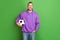 Photo of positive sporty guy hold soccer ball want play world cup match isolated over green color background