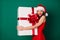 Photo positive stunning charming chic cute lovely girl in santa claus headwear cap hug embrace enjoy big x-mas fairy