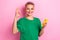 Photo of positive woman wear stylish green clothes okey hand show okey sign nice quality gadget device isolated on pink