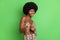 Photo of positive young dark skin woman point finger choose you cool isolated on shine green color background