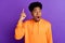 Photo of positive young genius dark skin man point finger up solution shocked isolated on purple color background