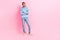 Photo of positive youngster man wear blue trendy clothes arm crossed look empty space interesting news isolated on pink