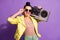 Photo of positive youth girl touch retro specs hold boom box  over violet color background