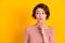 Photo of pretty adorable lady dreamy watch empty space kiss lips finger touch chin isolated on yellow color background