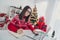 Photo of pretty businesswoman prepare wish list shopping online wear santa hat sweater in decorated x-mas home indoors