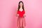 Photo of pretty charming lady hold big red paper heart hands showing lovely prom date invitation idea wear casual white