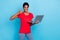 Photo of pretty confident short hair person dressed red t-shirt typing modern gadget showing thumb up isolated blue