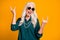 Photo of pretty crazy cheerful white haired grandma lady showing finger horns metal music lover senior party wear green