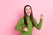 Photo of pretty happy young woman raise fists good mood winner celebrate isolated on pink color background
