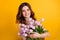 Photo of pretty lady having best weekend holding pink tulips in hands wear tank-top isolated yellow background