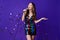 Photo of pretty lady holiday concept sing mic song wear shiny sequins mini dress isolated purple color background