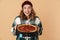 Photo of pretty pleased woman holding box with pizza and smiling